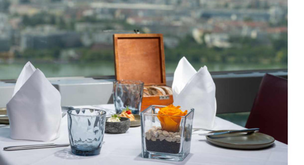 What does the “Cover Charge” at the Turm Restaurant mean?
